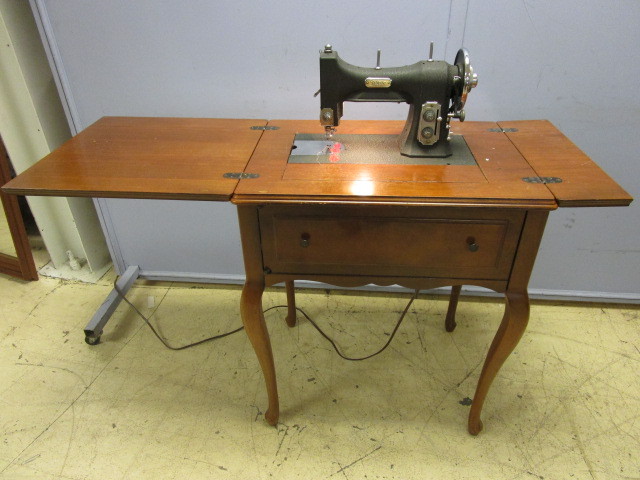 lot 412 image: ANTIQUE ELECTRIC SEWING MACHINE IN DELUXE WOOD CABINET
