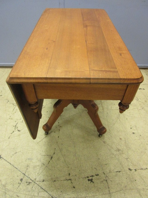 lot 426 image: ANTIQUE SOLID WOOD TABLE WITH DROP LEAF