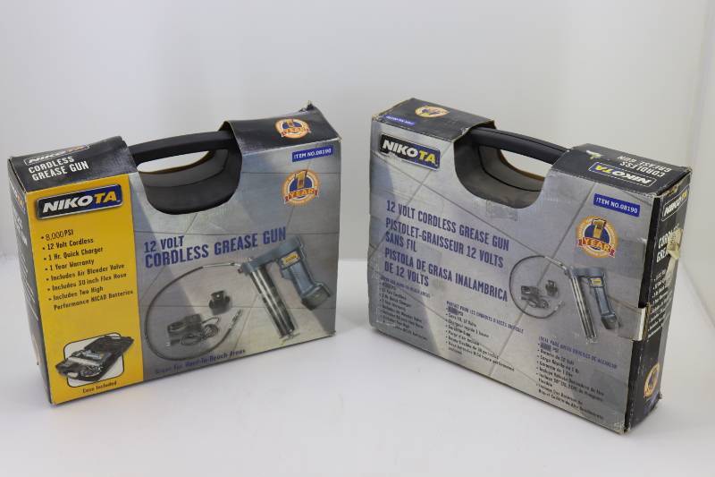 lot 4 image: (2) Nikota Open Box 12v Grease Guns
