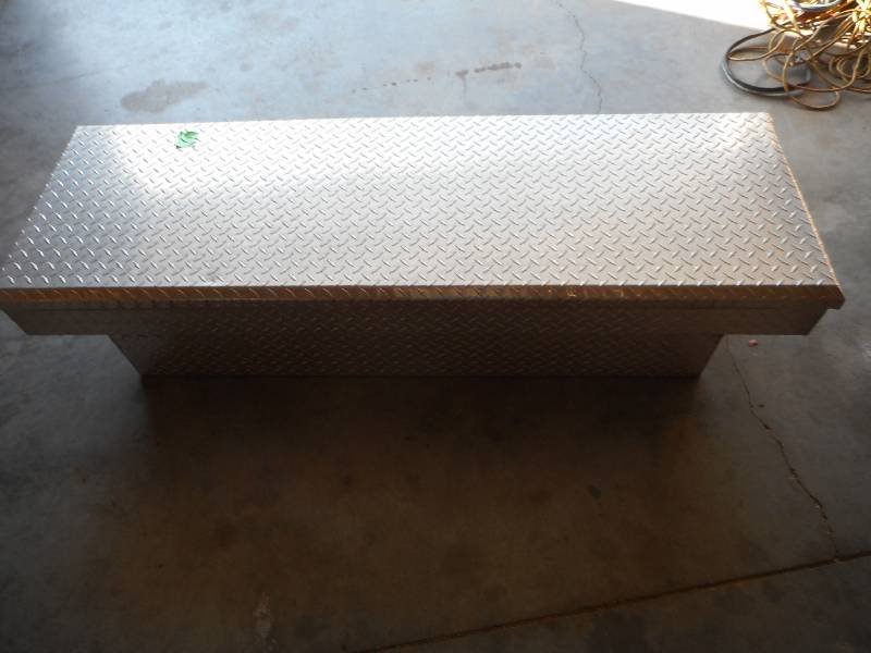 Diamond-Plated Truck Tool Box with Miscellaneous Tools and Items