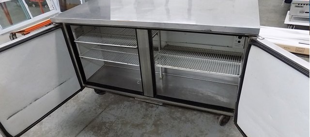 lot 10 image: True, Mod #TUC-60F, two door under counter freezer, NSF, caster mounted, 115 volts, 10.9 amps,Runs Freezes