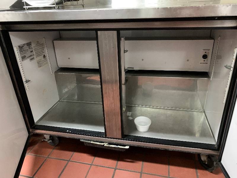 lot 25 image: True, Mod #TWT-48, worktop refrigerator, NSF,  caster mounted, 115 volts, 8.6 amps, 48x30x36H w4 back splash.Runs Cools
