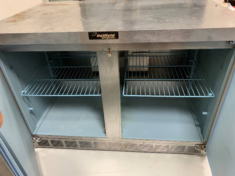 lot 17 image: Delfield 2 Door Stainless Steel Under Counter Cooler on Casters - Model # UC4448N-A8 - 115 Volts - 7.2 Amps - 48 x 31.5 x 34 - NSF ApprovedRuns COOLS