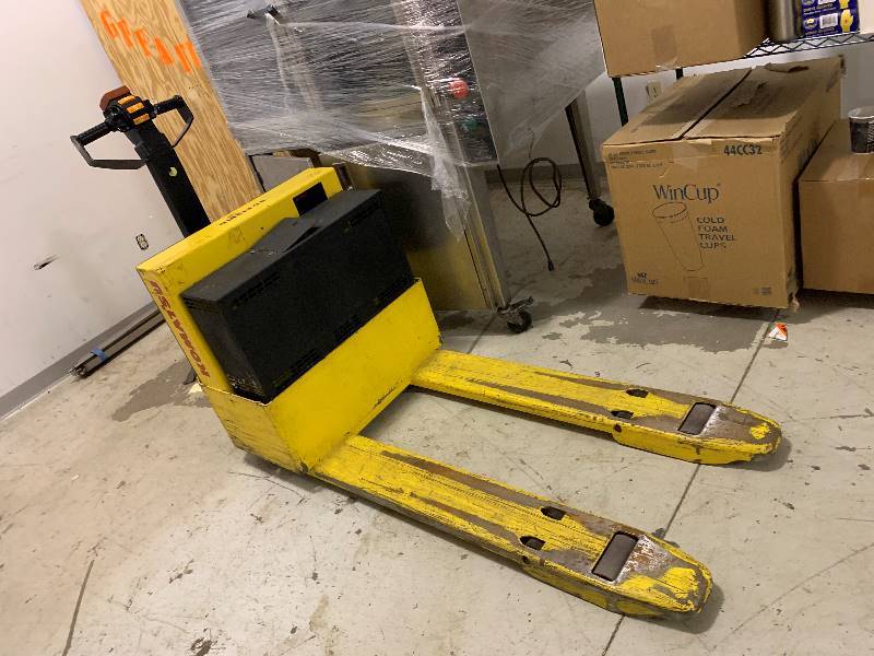 lot 93 image: Battery operated Pallet Jack note Needs Battery Work