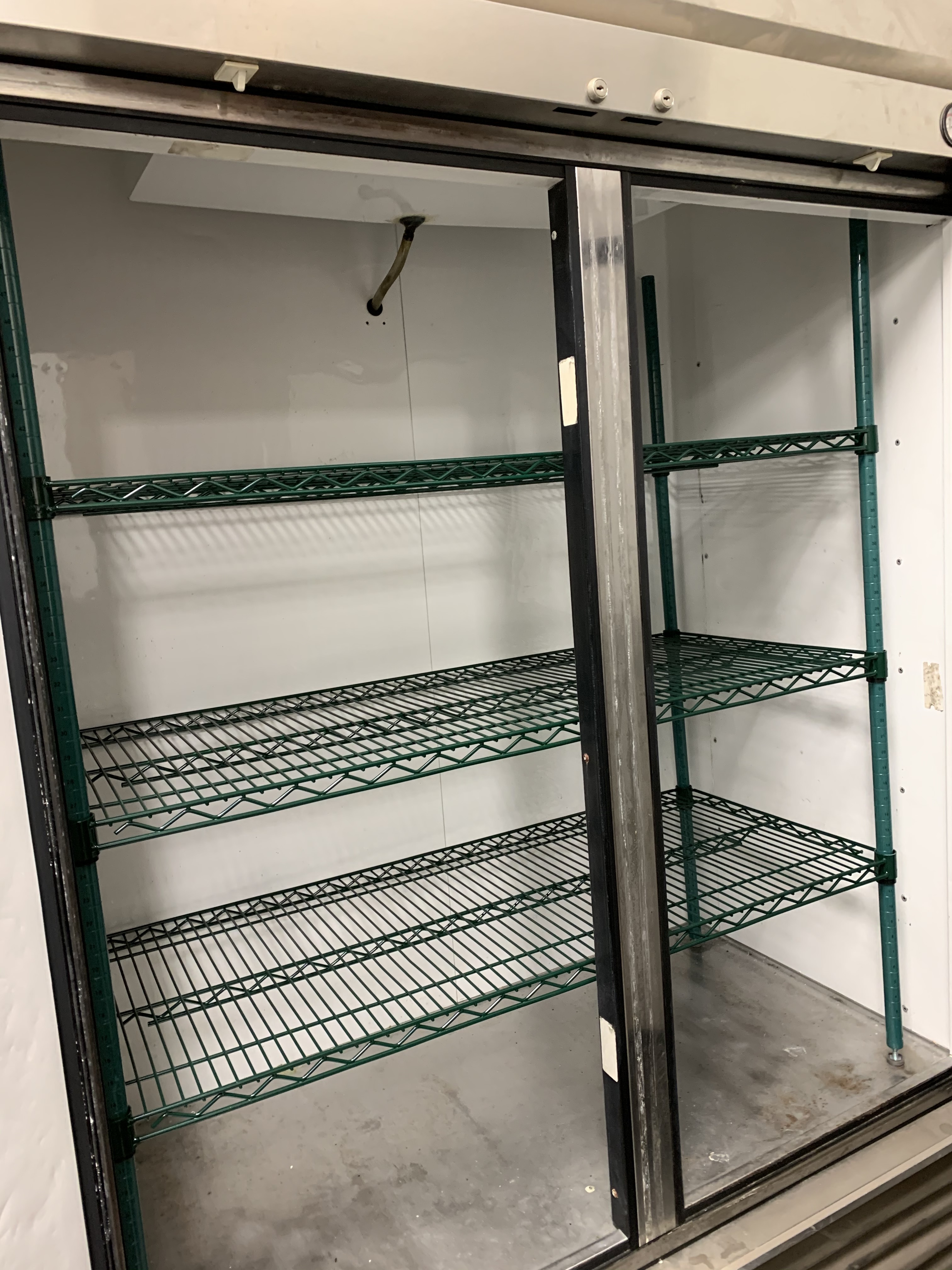 lot 11 image: True, Mod #T-49F, two door commercial freezer, NSF,caster mounted, 115 volts, 14.8 amps, 54x30x82H.Runs Freezes