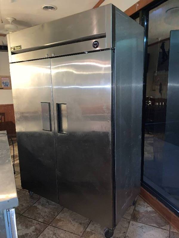 lot 16 image: True, Mod #TM-52F, two door commercial freezer, NSF, caster mounted 115 volts, 14 amps,Runs Freezes