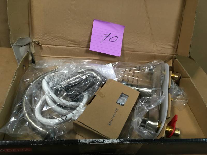 Delta Vessona 2-Handle Standard Kitchen Faucet with Side Sprayer in Stainless in very good conditition