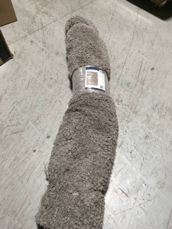 lot 32 image: TrafficMASTER Greystone Shag 5 ft. x 7 ft. Area Rug in good condition