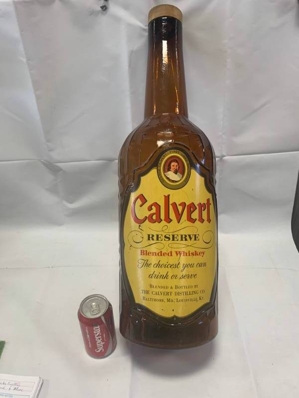 lot 1 image: Massive 26 Tall Calvert Reserve Antique Glass Bottle