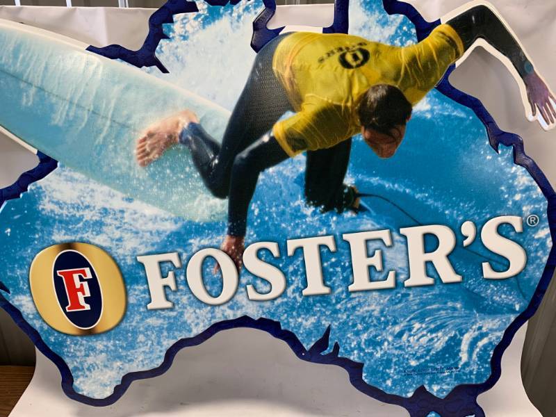 lot 8 image: Fosters Lager Metal Surfer Beer Sign