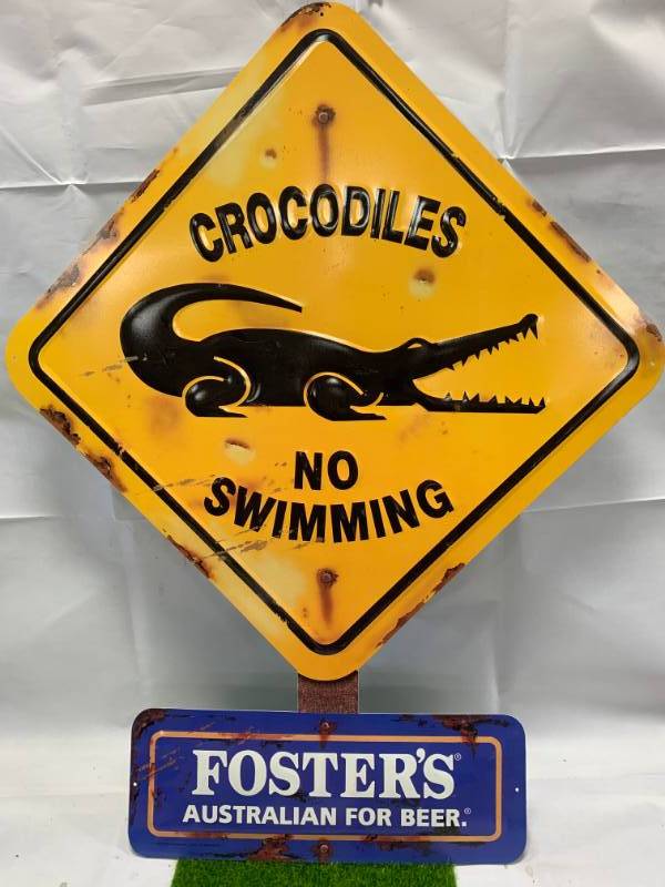 lot 91 image: Fosters Crocodiles No Swimming Metal Sign