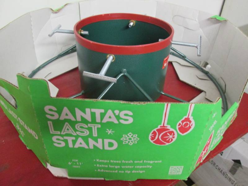 lot 199 image: Christmas Tree Stand 6-11 Tree 2...