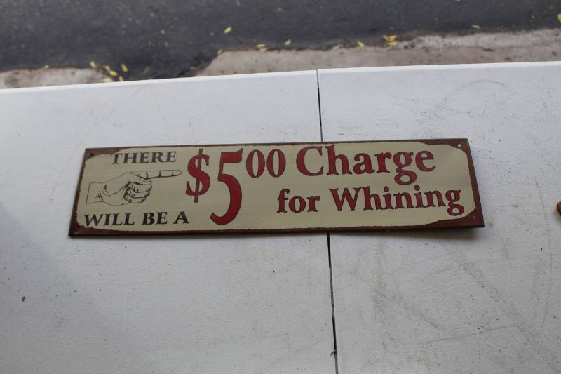 lot 289 image: $5 Whining Charge Metal Sign