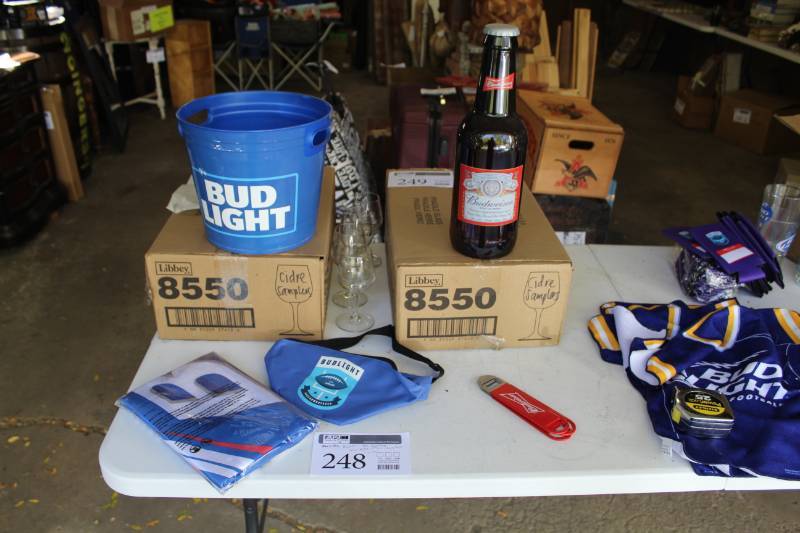 lot 248 image: Bud Light, Budweiser Beer Plastic Bucket, NFL Bud Flag, Glass Bottle, Fanny Pack, Bottle Openers