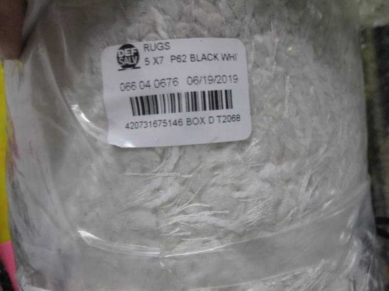 lot 13 image: 5x7 project 62 black and white rug...