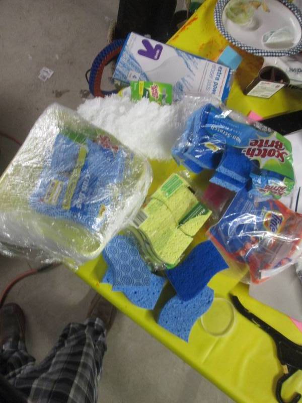 lot 133 image: lot of sponges and oxyclean, pods...