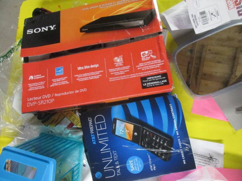 lot 151 image: sony blue ray player and at&T phone...