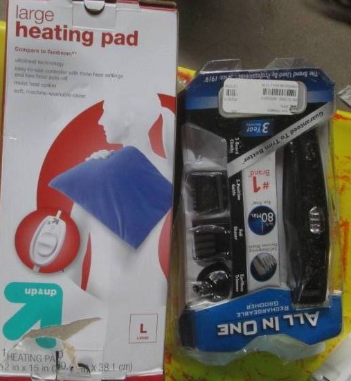 lot 152 image: heating pad and trimmer set...
