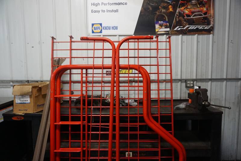 lot 67 image: Red Metal Futon Bed Frame