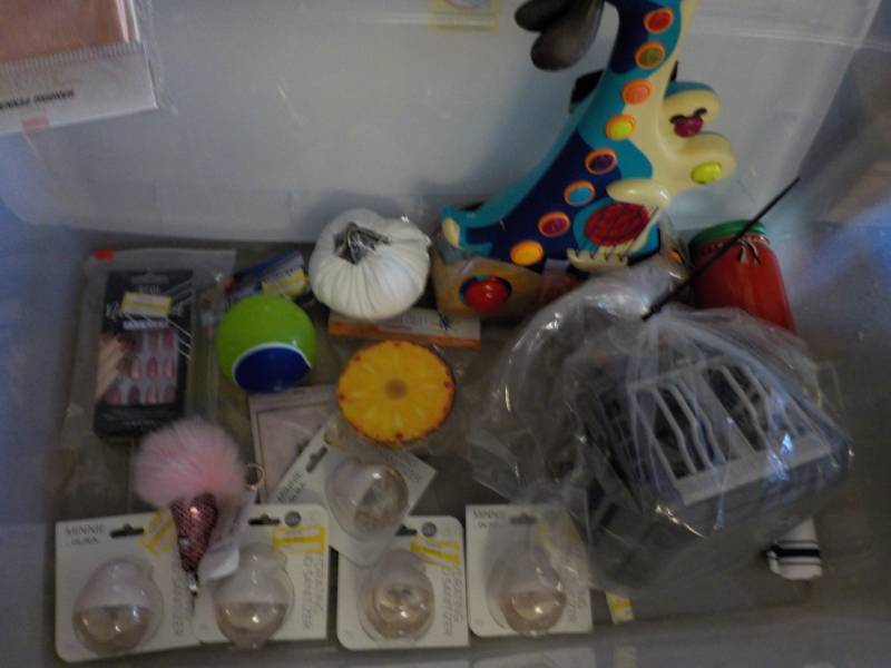 lot 43 image: Toys and more in a covered tote...