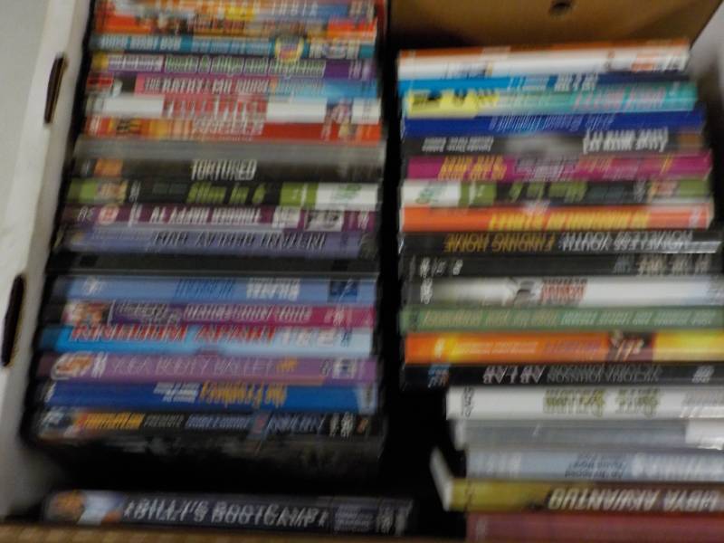 lot 227 image: Box of DVDs and Case of Honey Buns...