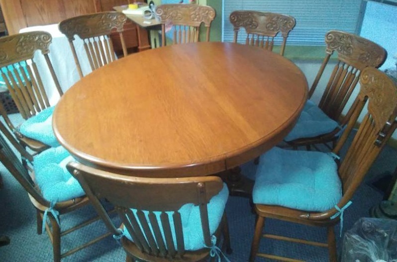lot 145 image: 54 inch oak dining table, 8 chairs, 4 leaves.