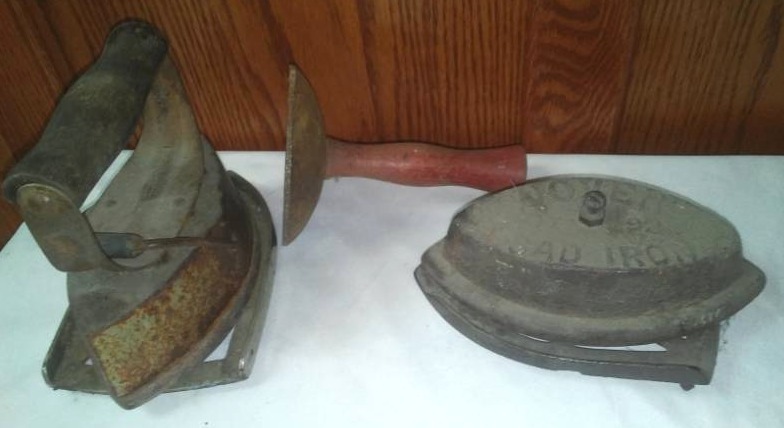 lot 162 image: 2 sad irons and stands.