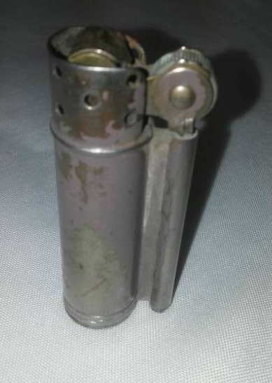 lot 236 image: WWI military issued lighter.