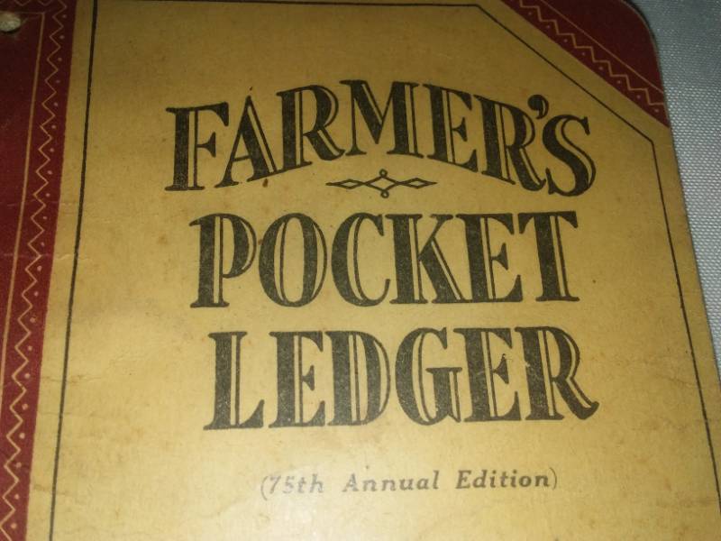 lot 418 image: John Deere promotional advertising - vintage. Farmers pocket Ledger