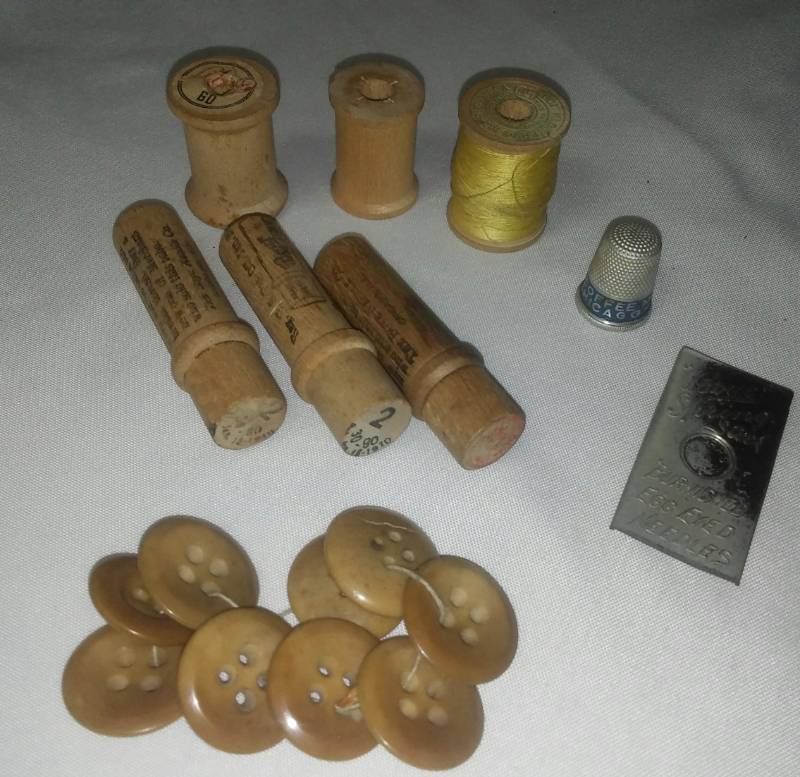 lot 391 image: WWI Wood sewing needle boxes and needles, bobbins and more.