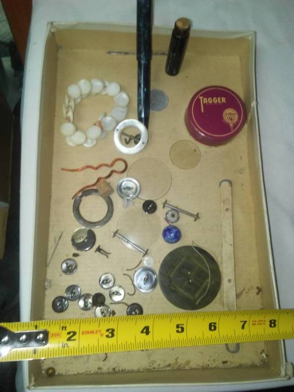 lot 393 image: WWI era buttons, lenses, ribbon tin, ink bottle and fountain pen