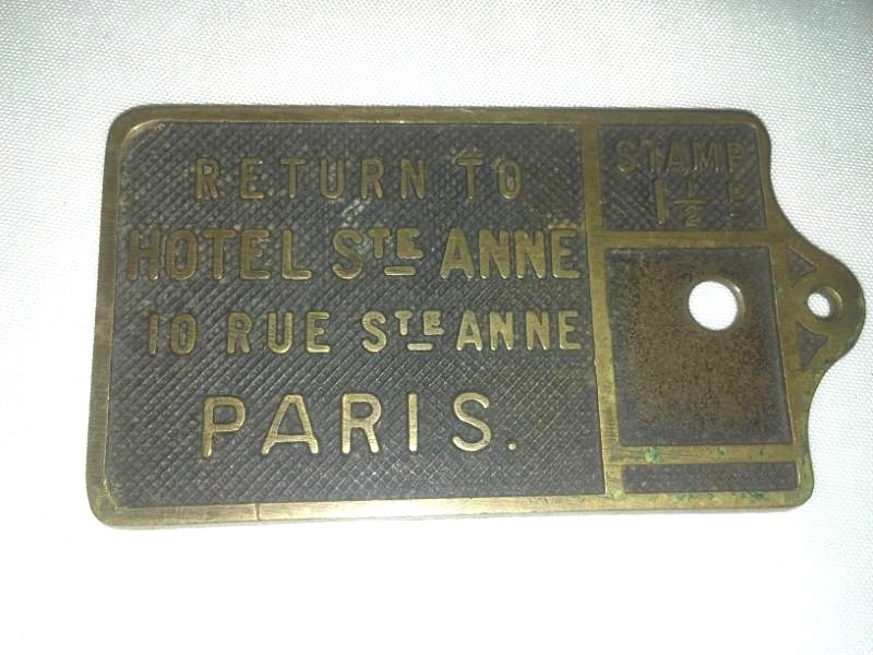 lot 394 image: Brass WWI Paris France, room key marker.