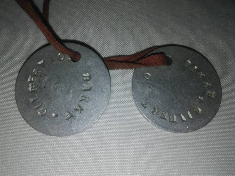 lot 404 image: WWI dog tags - 2 Gilbert O. Bakke.