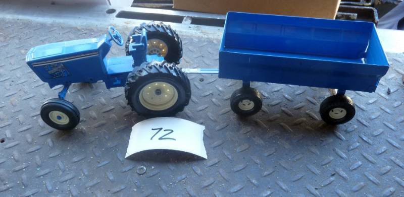 lot 72 image: Ford tractor and wagon, both metal...