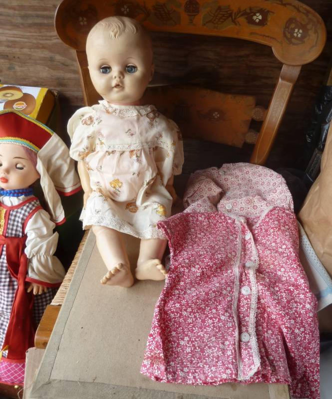 lot 102 image: 4 dolls, one old with handmade clot...