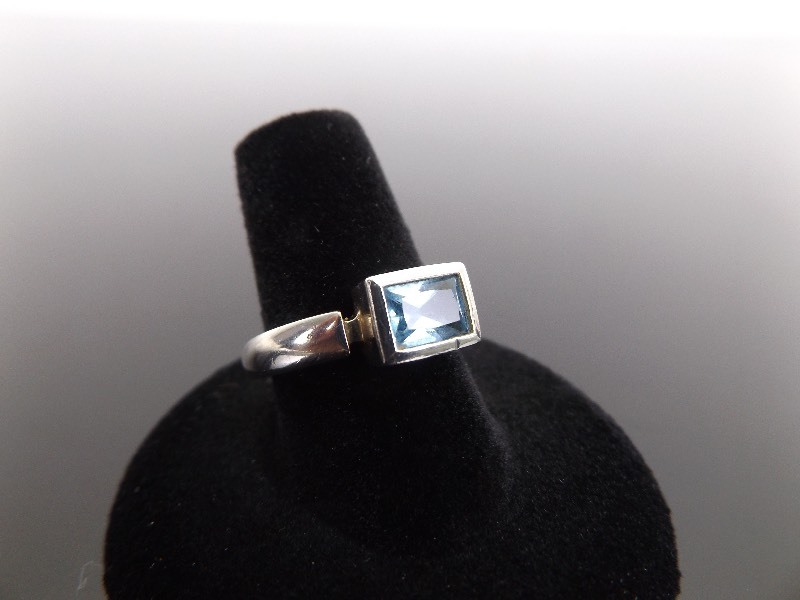 lot 37 image: .925 Sterling Silver Emerald Cut Crystal Ring Size 8