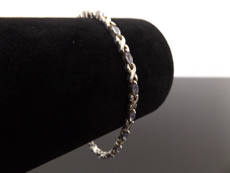 lot 51 image: .925 Sterling Silver Marquise Cut Amethyst Hugs and Kisses Tennis Bracelet