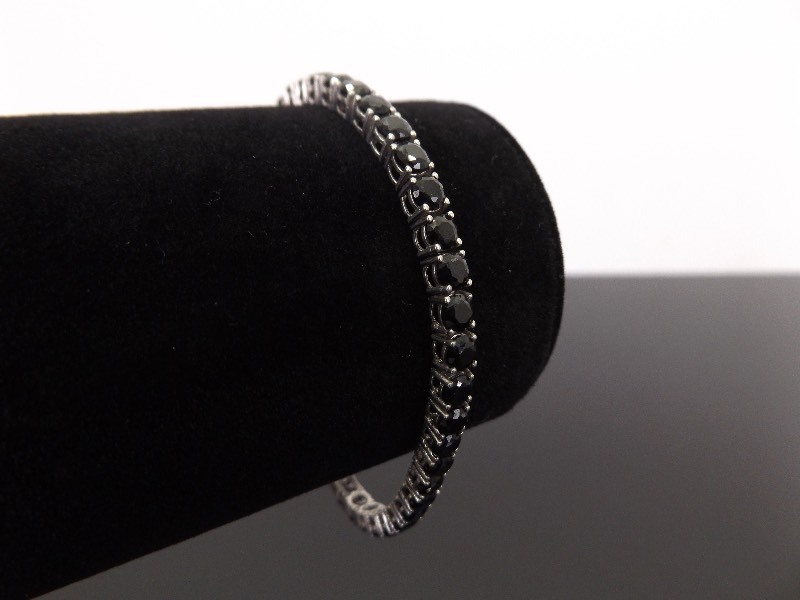 lot 53 image: .925 Sterling Silver Faceted Onyx Tennis Bracelet