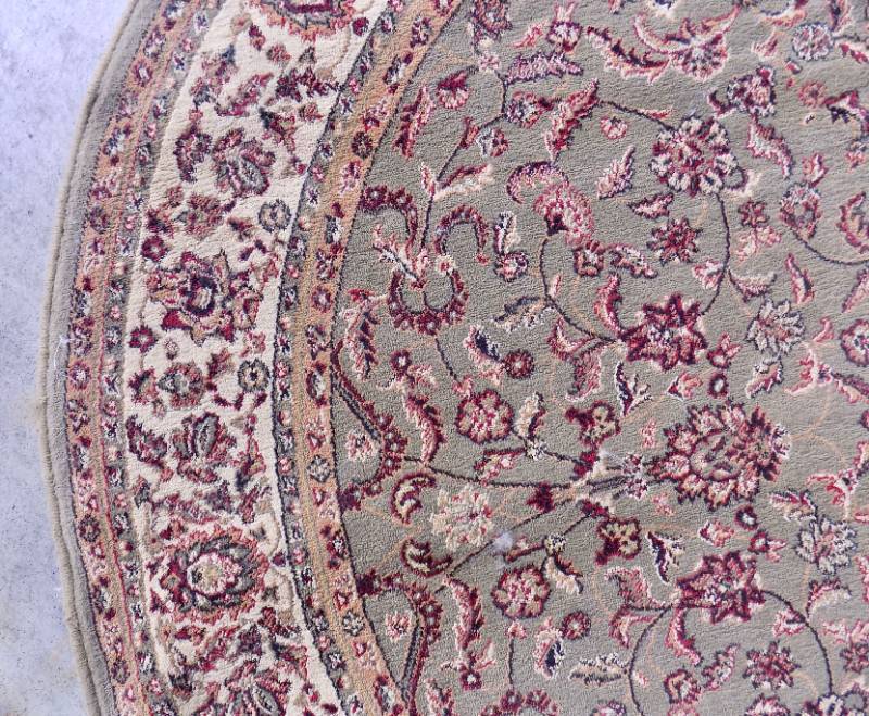 lot 30 image: (used) 63 Diameter Round Taupe Area Rug