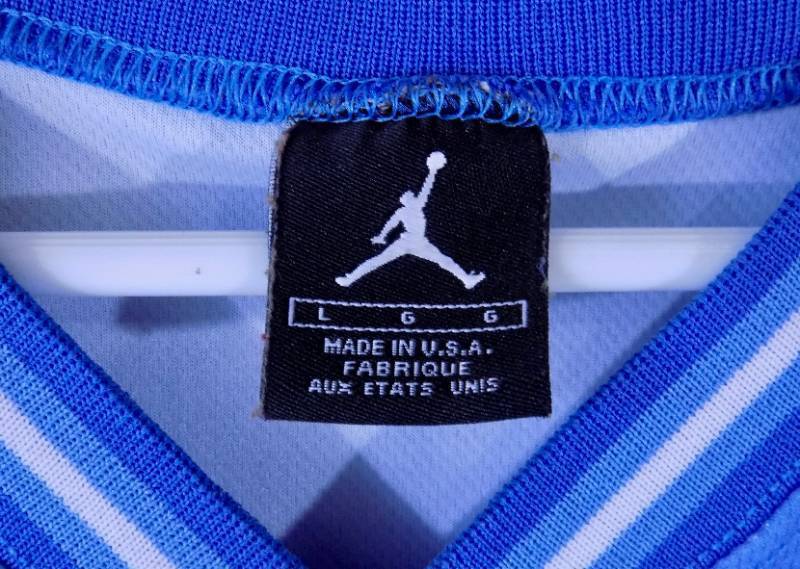 lot 6 image: (never worn) Large - Jordan performance brand of excellence  - North Carolina #22 Basketball Jersey