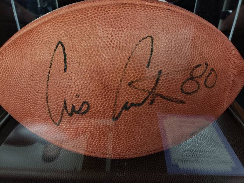 lot 30 image: Cris Carter Signed Full-Sized Football in Deluxe Mirrored Display Case (COA & Photo)