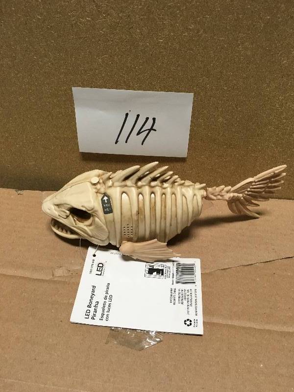 lot 114 image: Home Accents Holiday 4 in. Animated Swimming Piranha with LED Illuminated Eyes  in good condition
