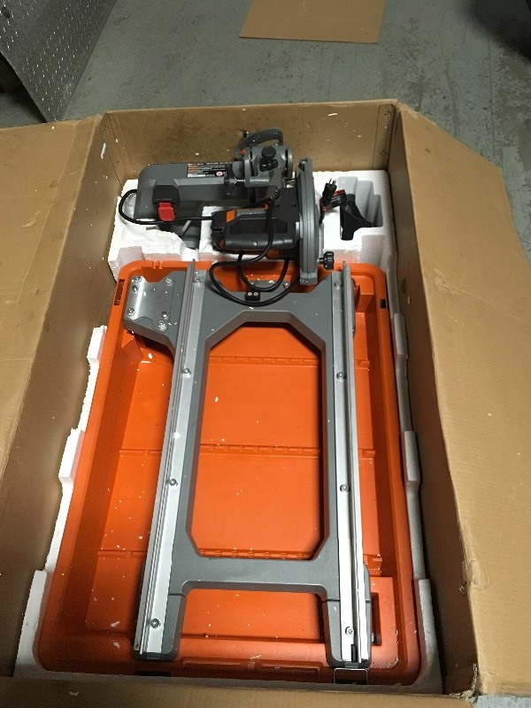 lot 163 image: RIDGID 12 Amp Corded 8 in. Wet Tile Saw with Stand in good conditions