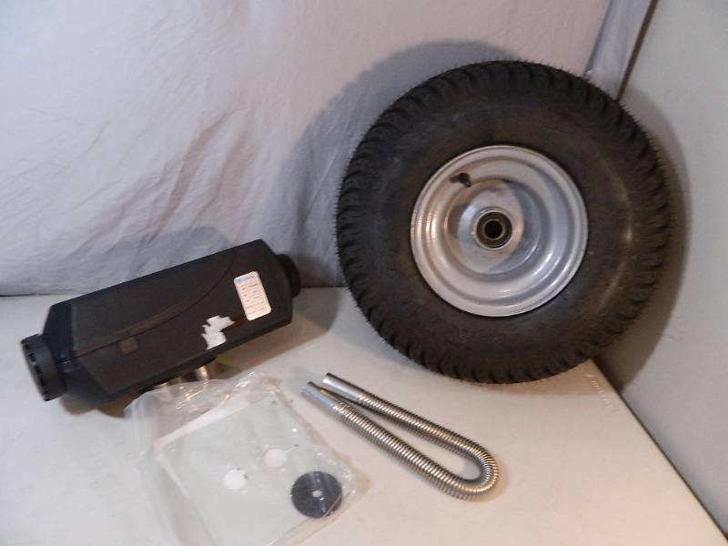 lot 121 image: New Diesel Aux Heater and Tire