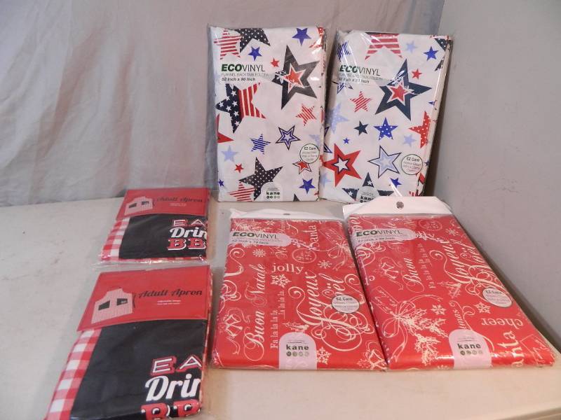 lot 187 image: 4 New Tablecloths and 2 New Adult Aprons