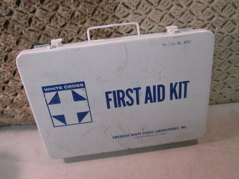lot 15 image: Metal First Aid Kit with Misc Conte...