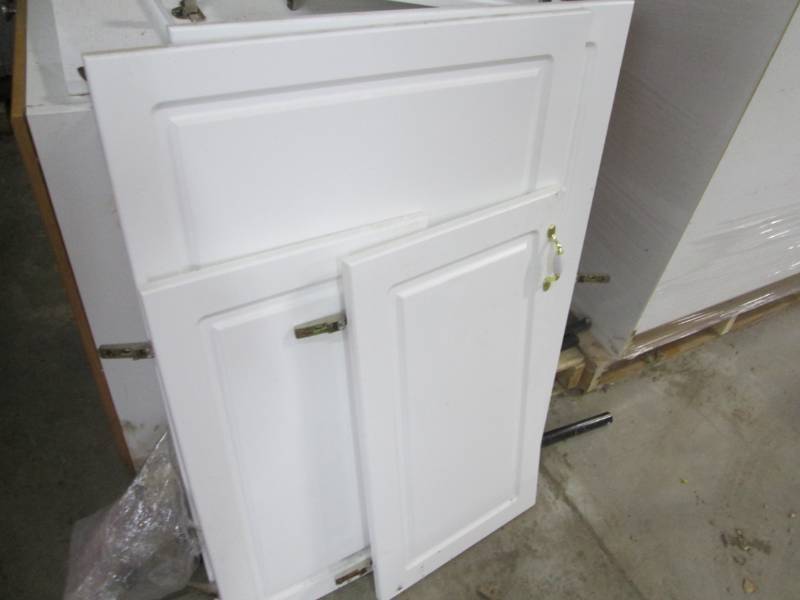Lot of cabinets, wood colored fromt...