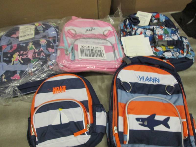5 Pre-Personalized Back Packs...