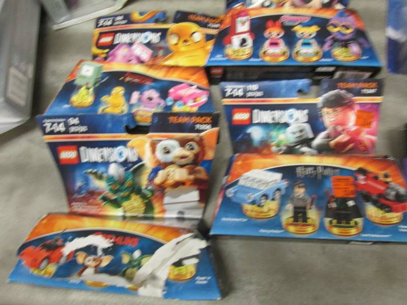 4 Assorted Legos Dimensions Team Pa...