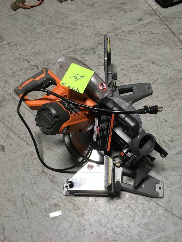 lot 39 image: RIDGID 15 Amp Corded 12 in. Dual Bevel Miter Saw with Adjustable Laser Guide, Carbide Tipped Blade,